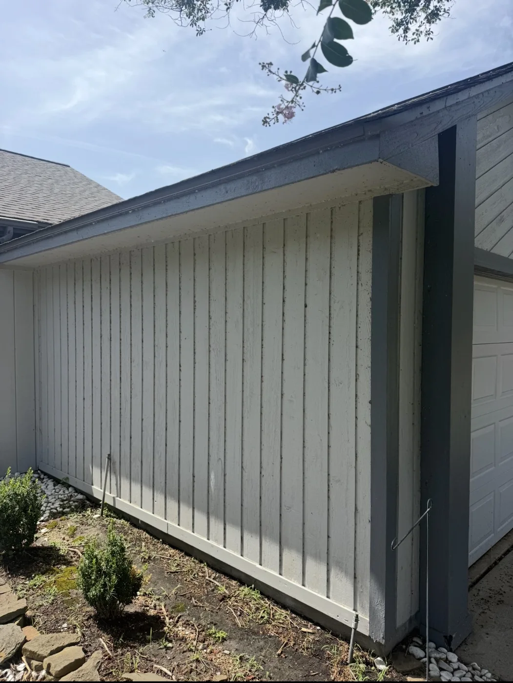 Exterior siding before cleaning with visible green buildup